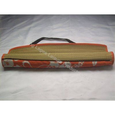 Rolled-up straw beach mat