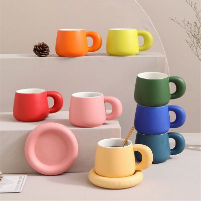 Color-glazed ceramic cups and saucers