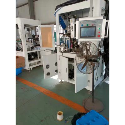 Automatic tube header machine for cosmetic plastic tubes