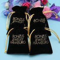 black color drawstring velvet jewelry pouch with gold logo printed thumbnail image